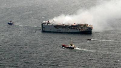 towing-begins-of-cargo-ship-ablaze-off-dutch-coast